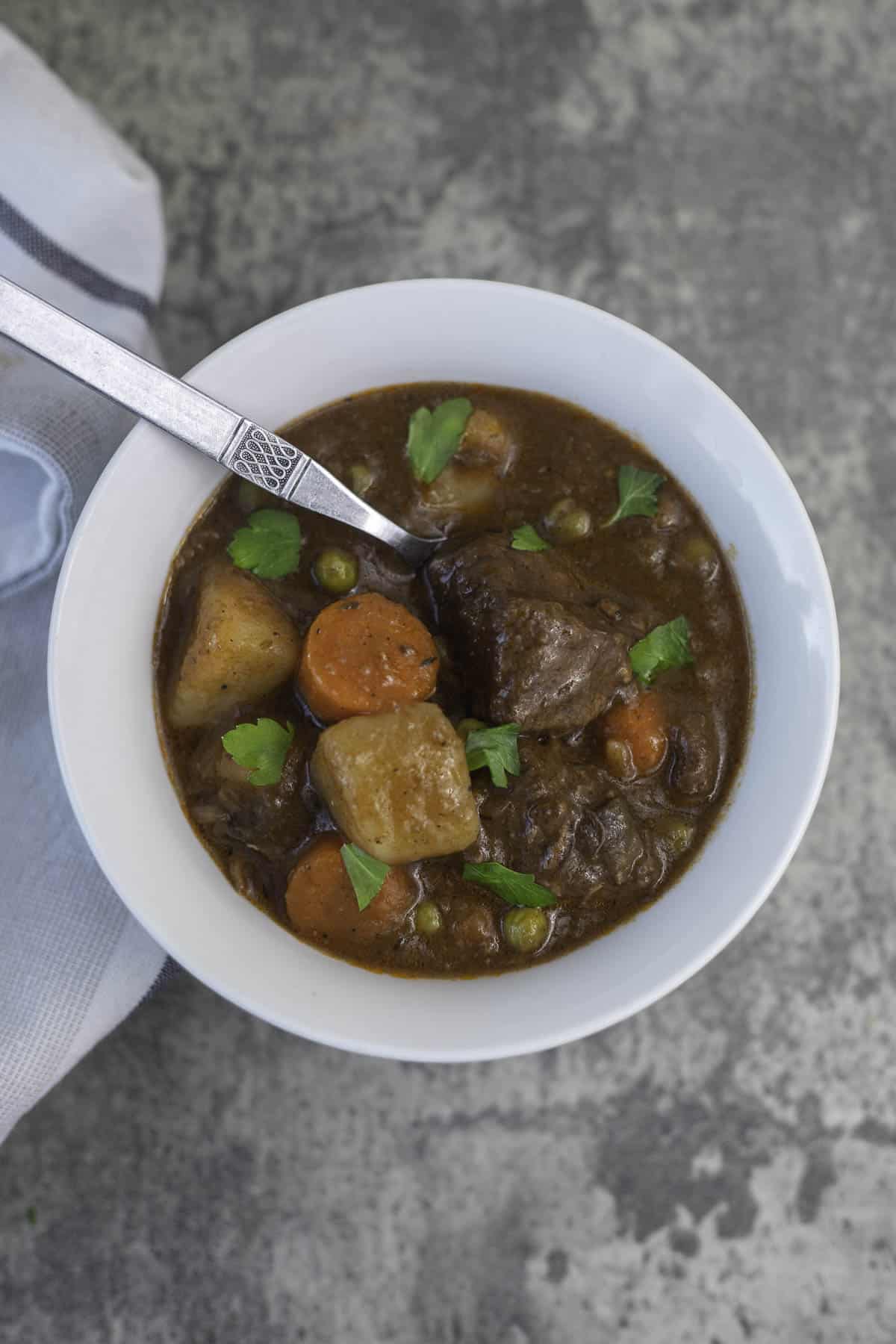 instant pot lamb stew in a white bowl