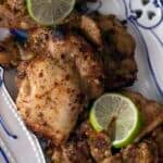 grilled boneless chicken thighs topped with sliced lime