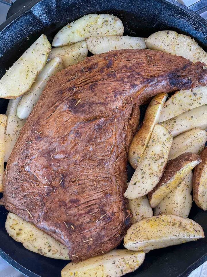 Add the tri-tip roast and potatoes to the pot.