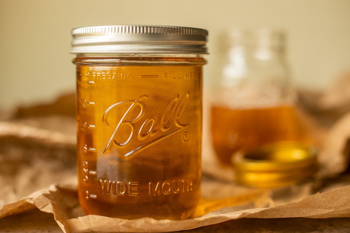 oil (tallow) in a jar with more in the background