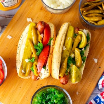 2 chicago style hot dogs with fixings
