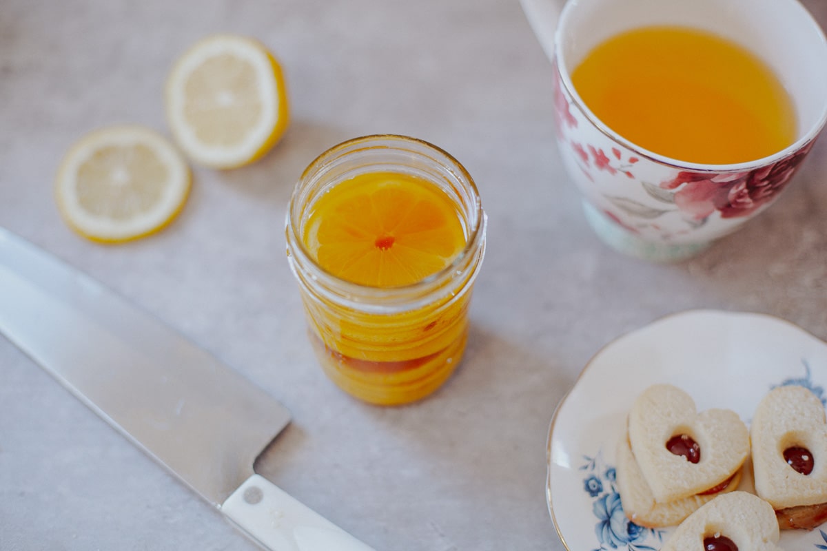 honey syrup with lemons in mason jar