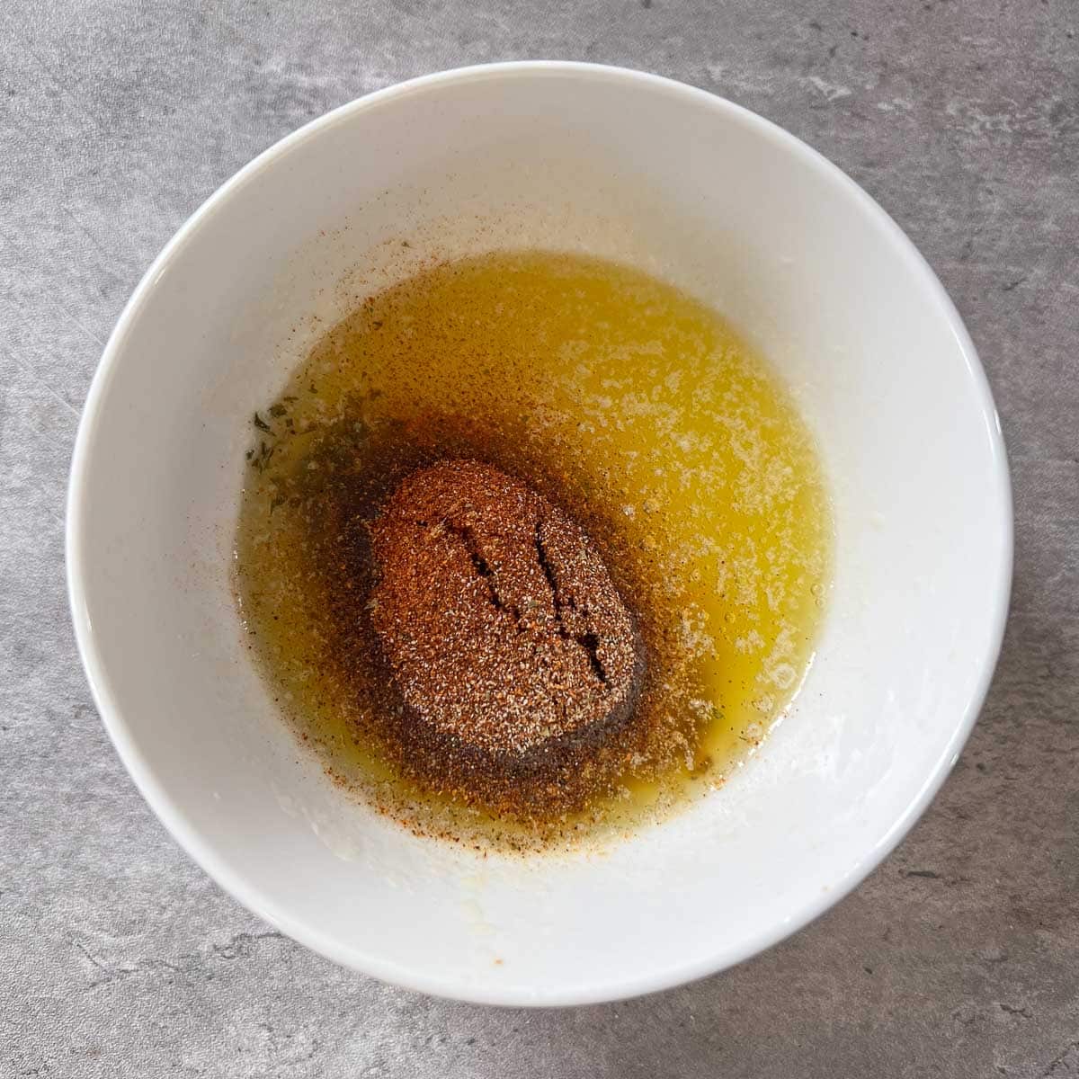 spices in bowl of melted butter