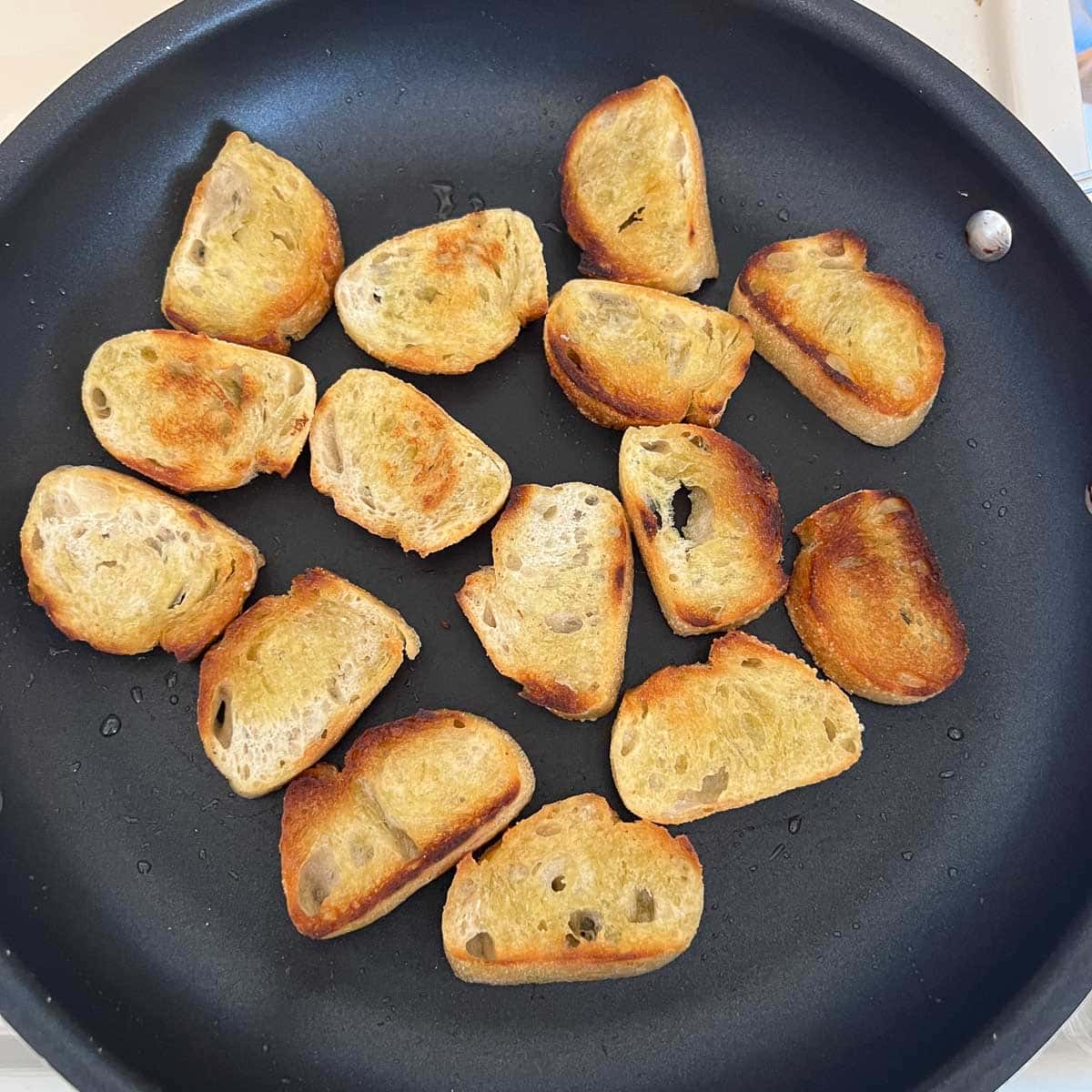 baguette slices after toasting in pan