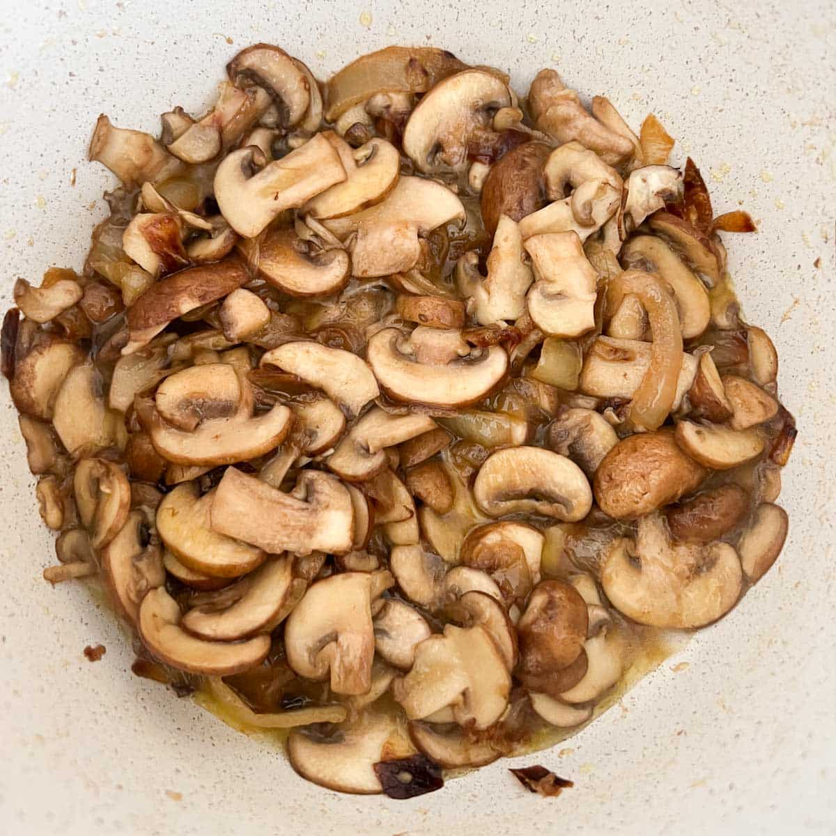 sauteed mushrooms in pot with caramelized onions