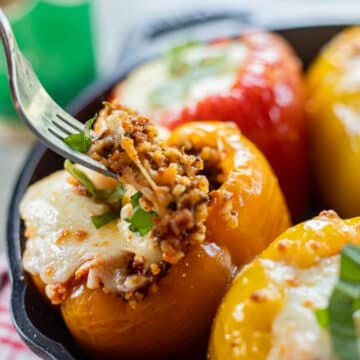 stuffed peppers in a cast iron skillet