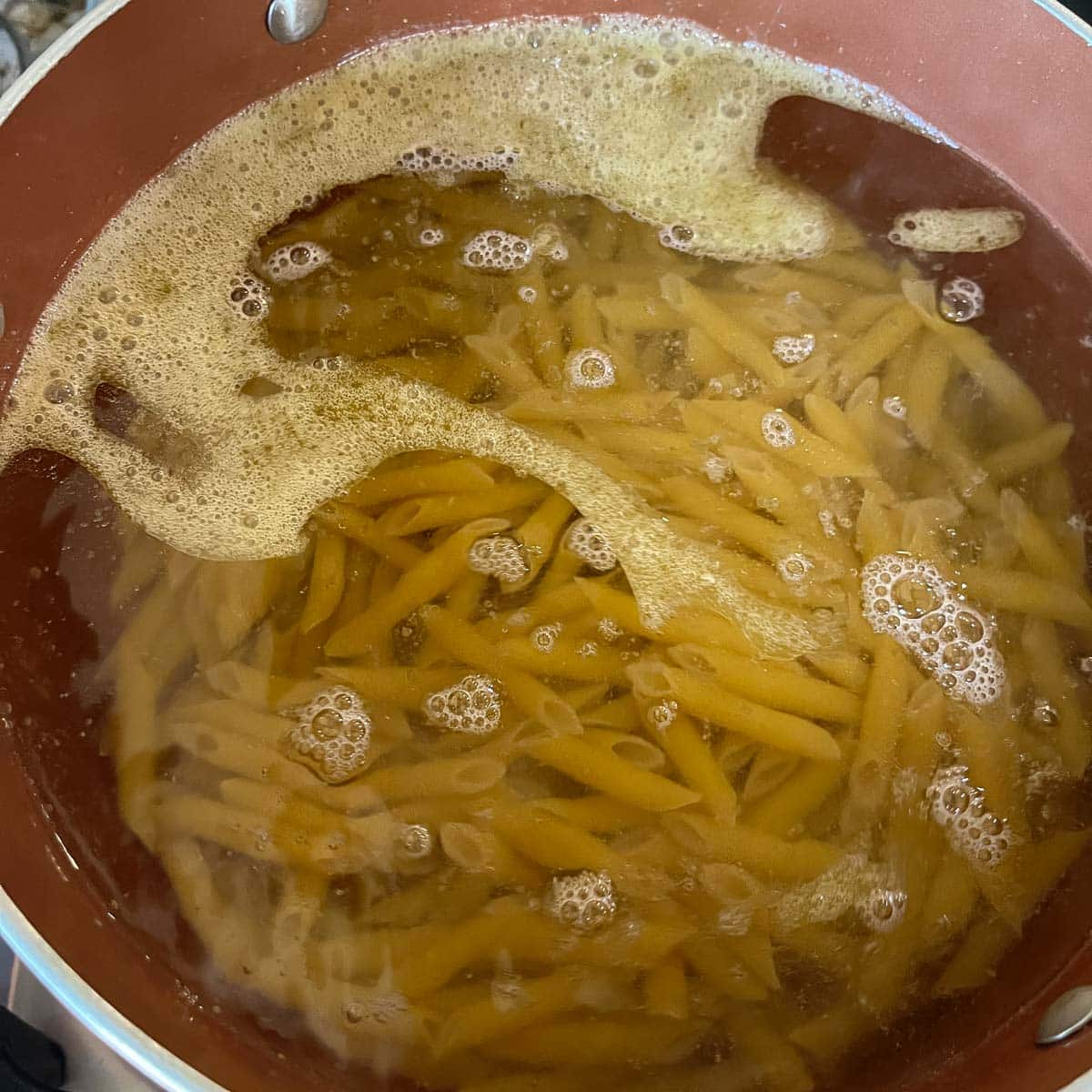 pasta cooking in a pot of water 