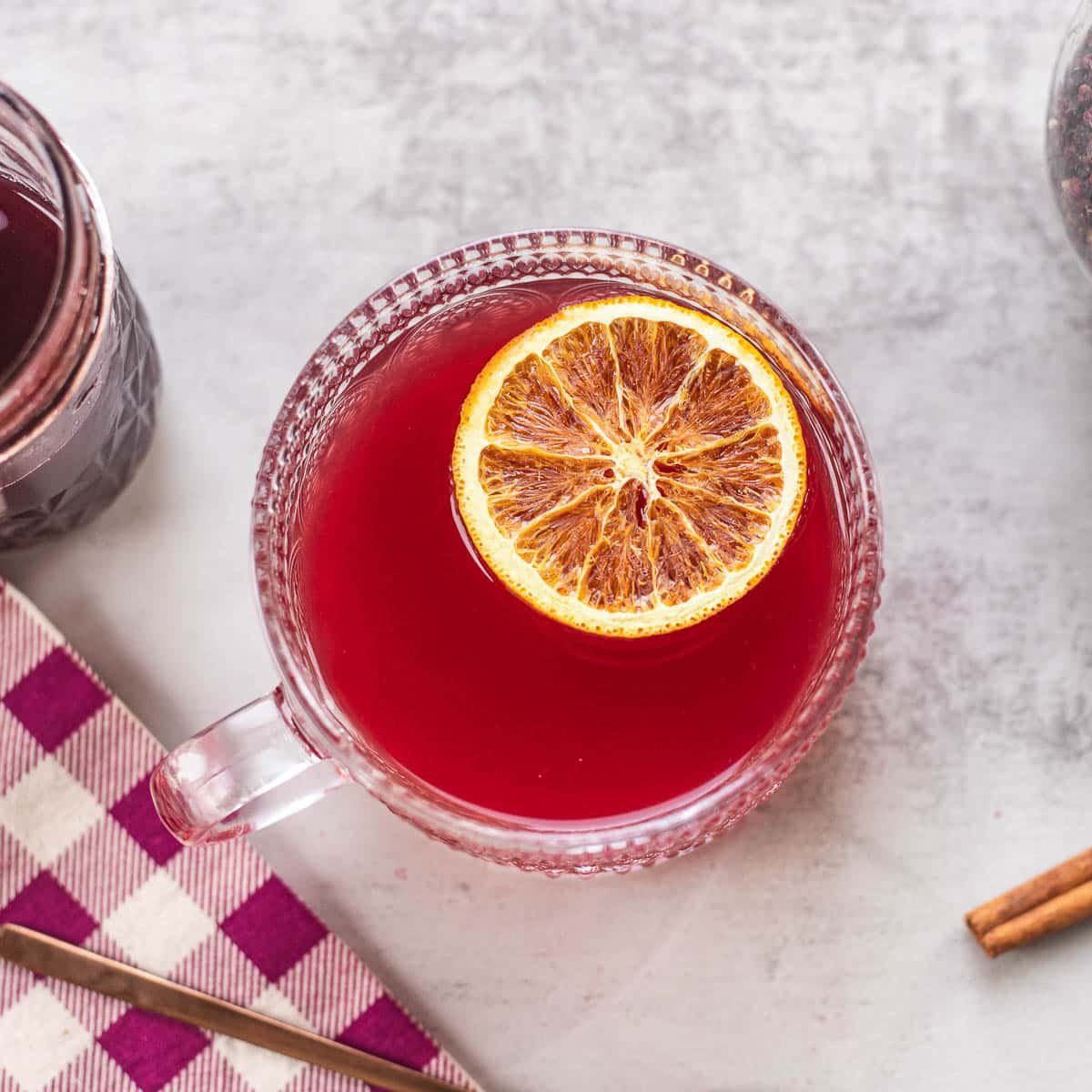 elderberry tea in a cup with an orange slice