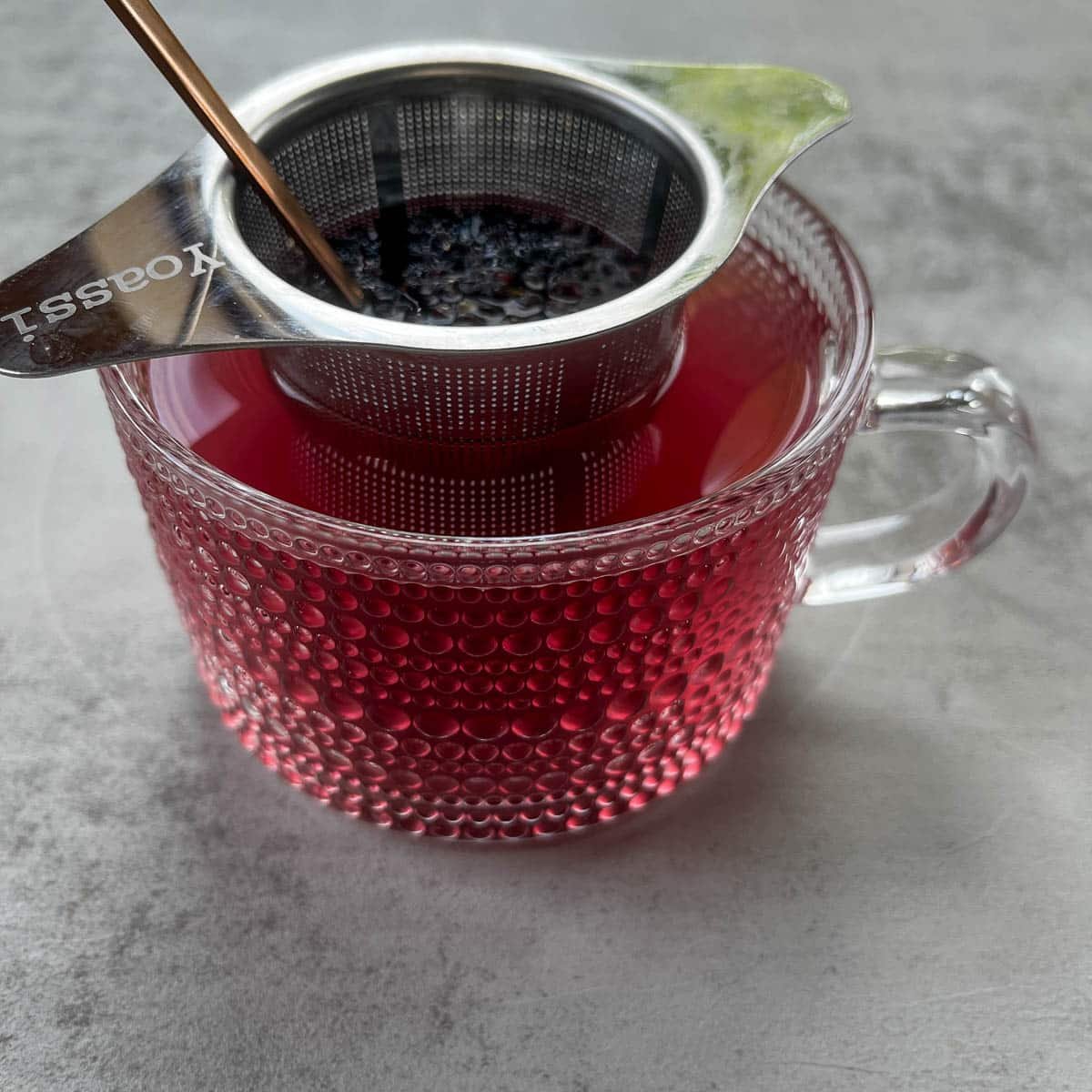 tea steeping in tea strainer