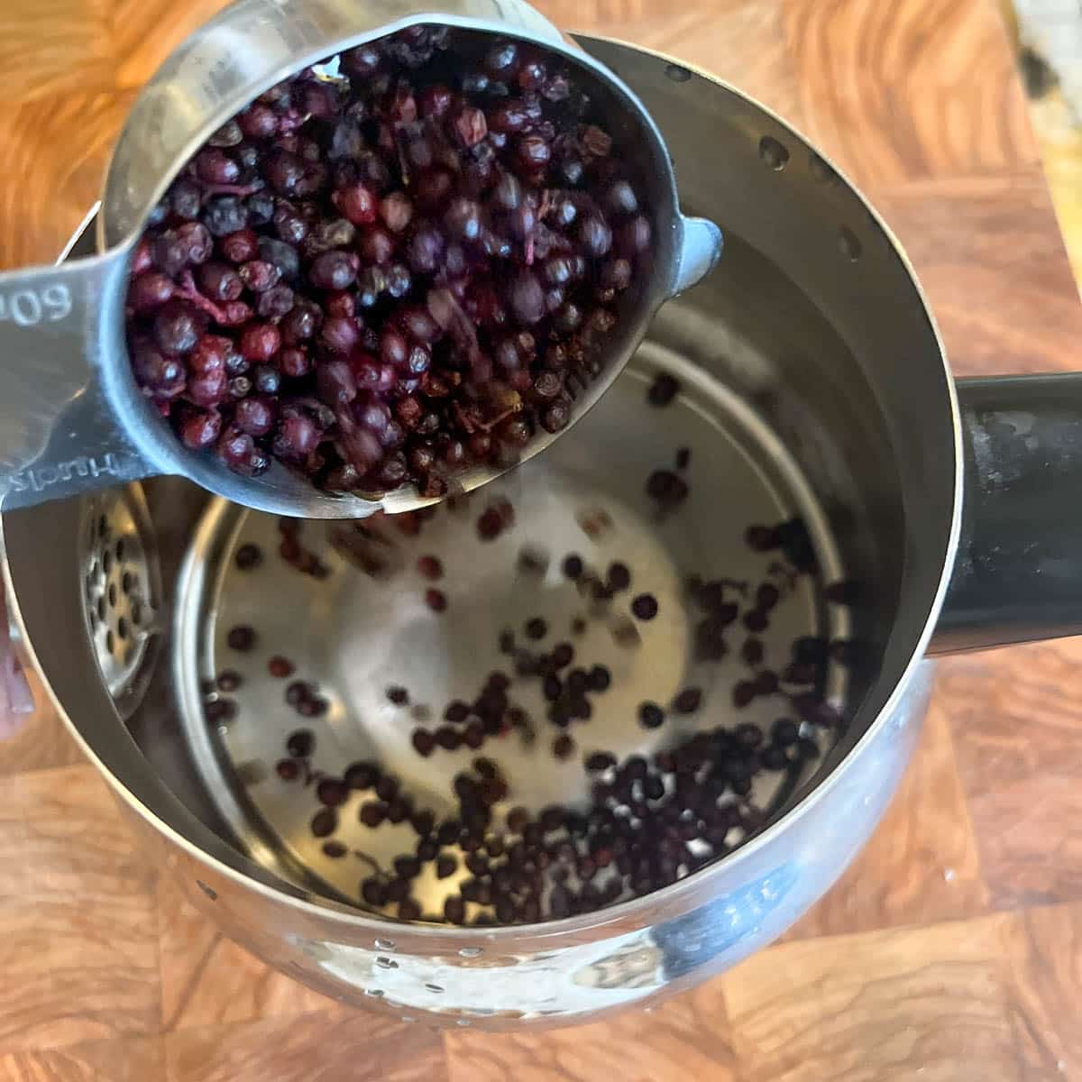 adding berries to pot