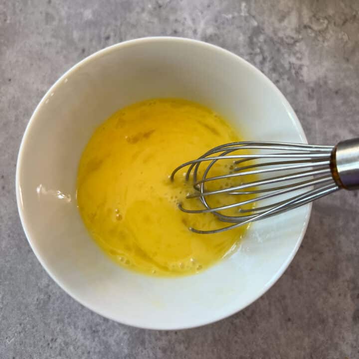 eggs after being beaten in bowl with whisk