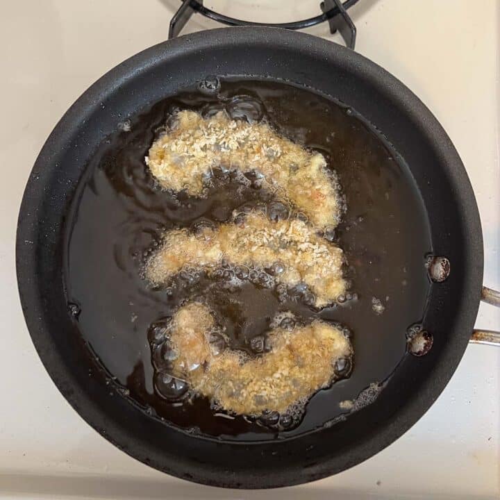 shrimp being fried in pan