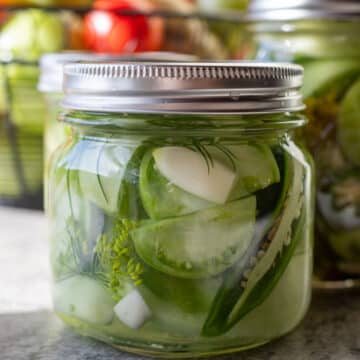pickled green tomatoes in a jar