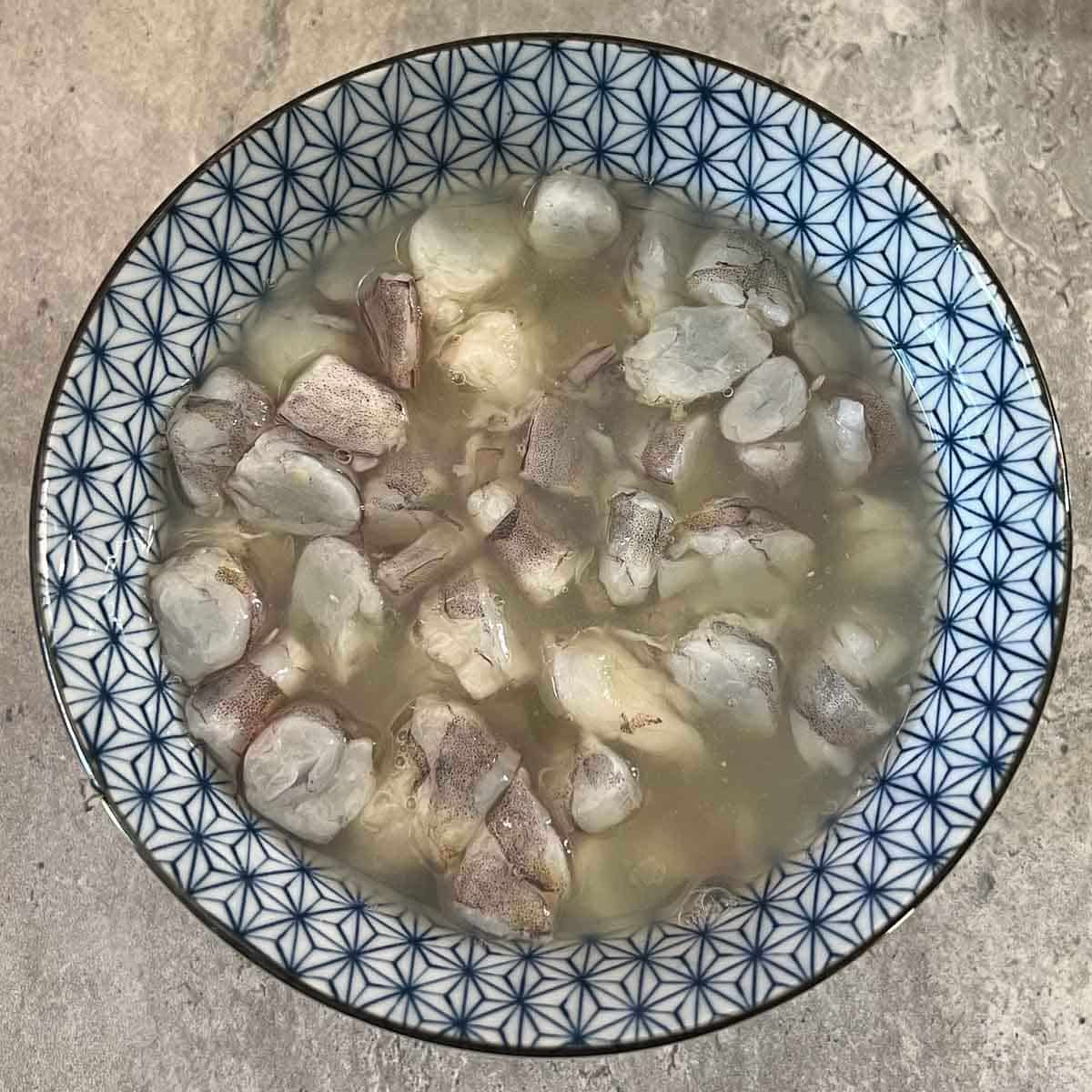 bowl with raw prawns in lime juice