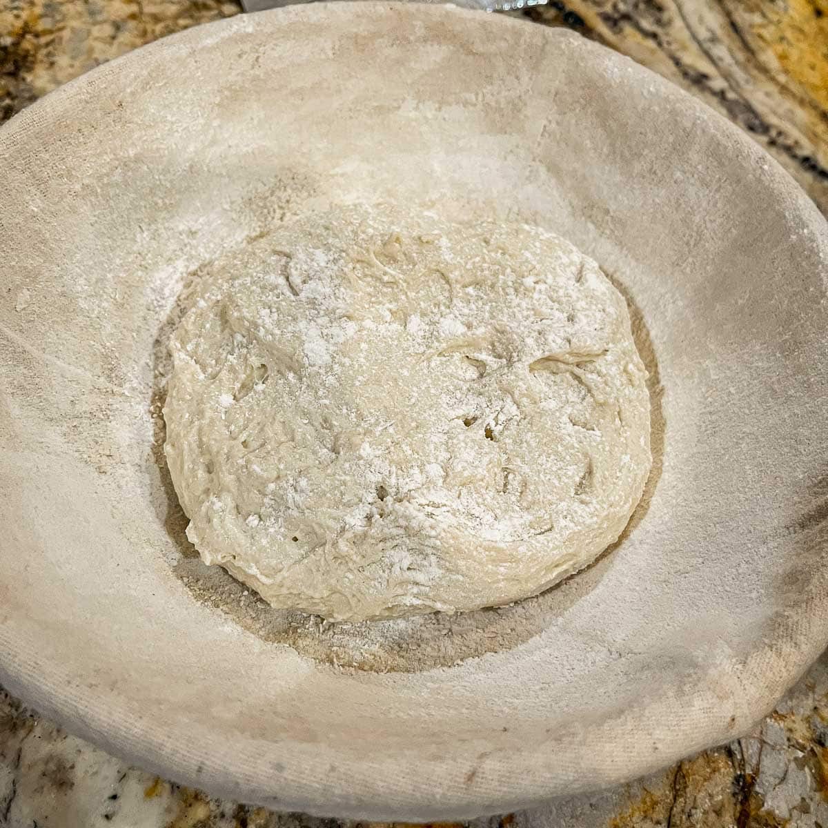 sourdough bread dough in a basket
