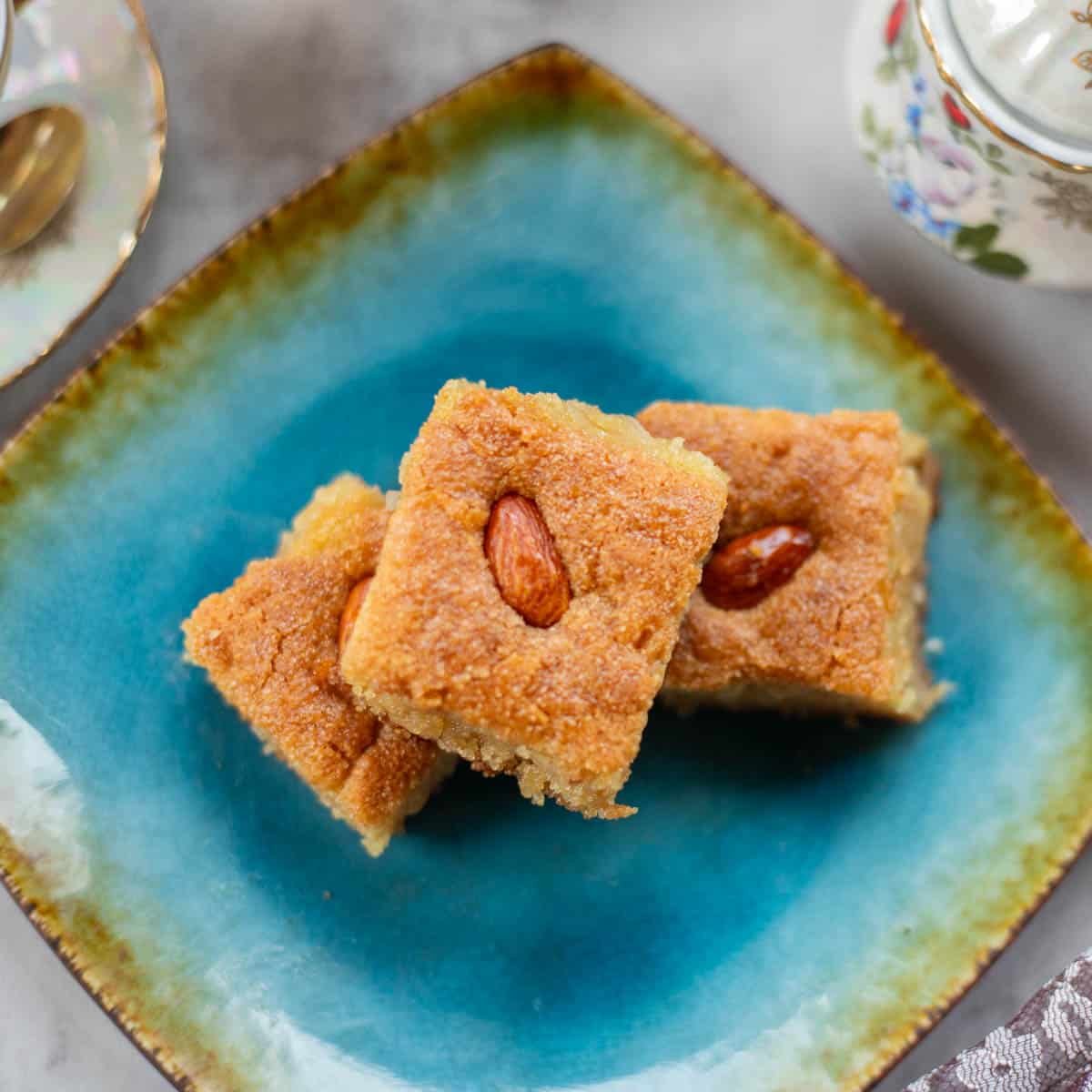 namoura or semolina cake on a blue plate