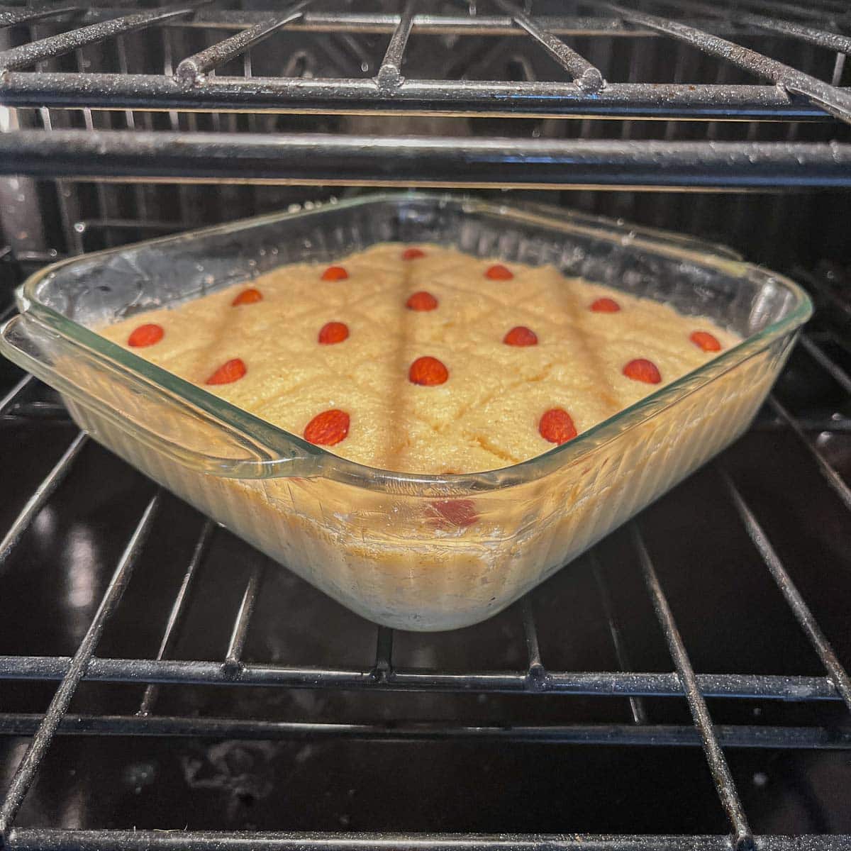 semolina cake / namourra being baked in the oven