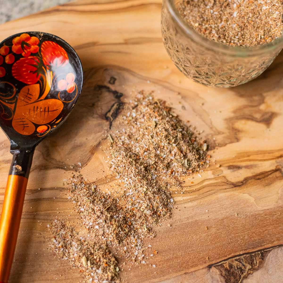 turkey rub on a cutting board with a colorful spoon