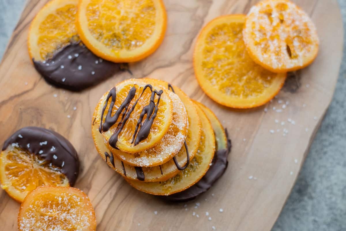candied orange slices stacked and drizzled with dark chocolate