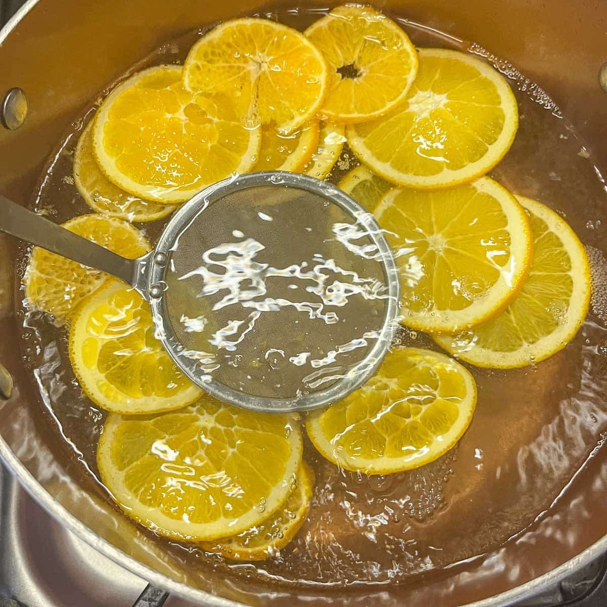 candied orange slices in a pot