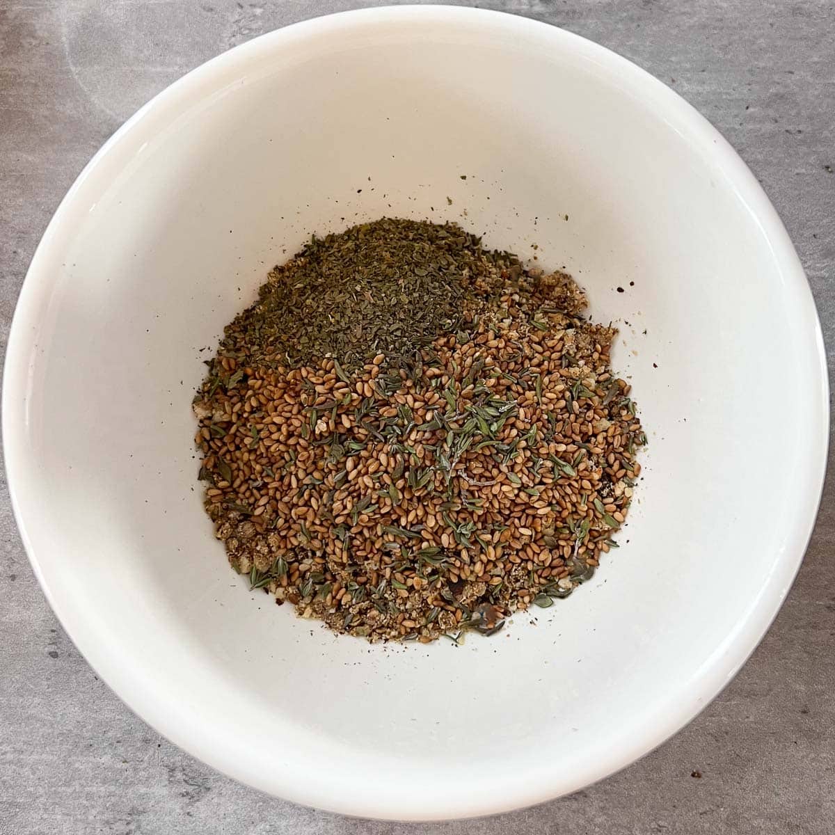 thyme, mint, and sesame sees added to dukka mixture