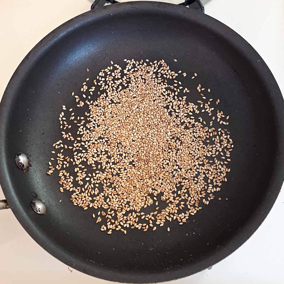 untoasted sesame seeds in pan