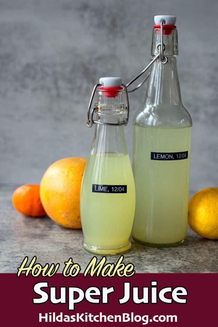 super juice bottles with citrus around it