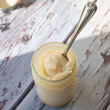 pork fat in a jar with a spoon in it