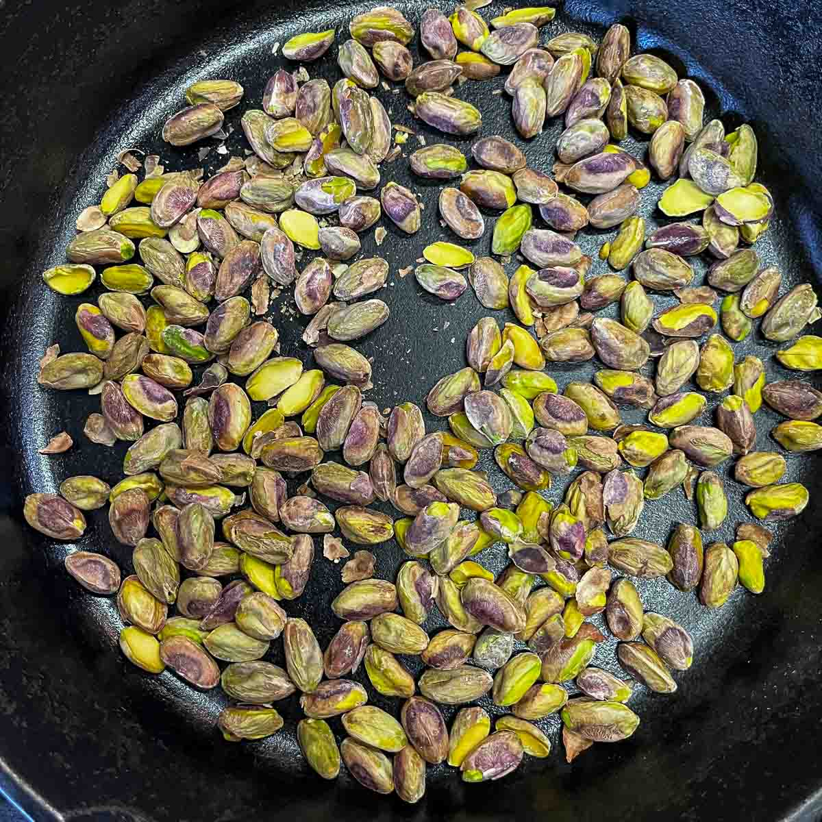 toasted pistachios in a pan
