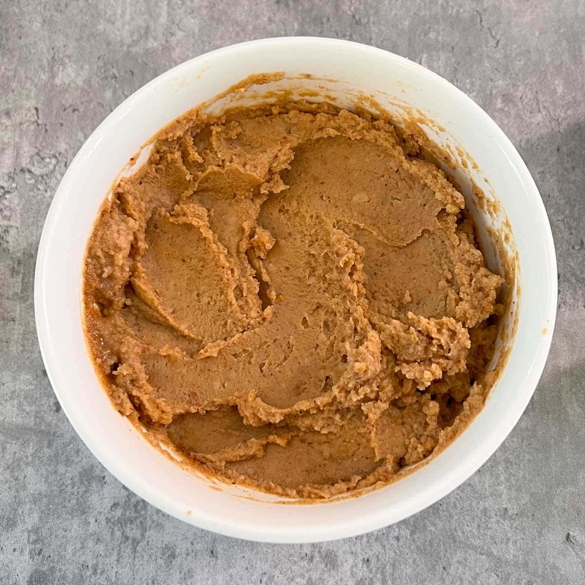 microwaved refried beans with taco seasoning mixed in