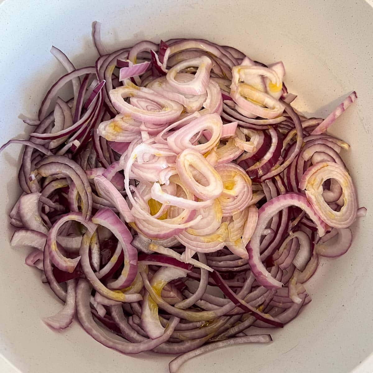 onions and shallots in pot with olive oil
