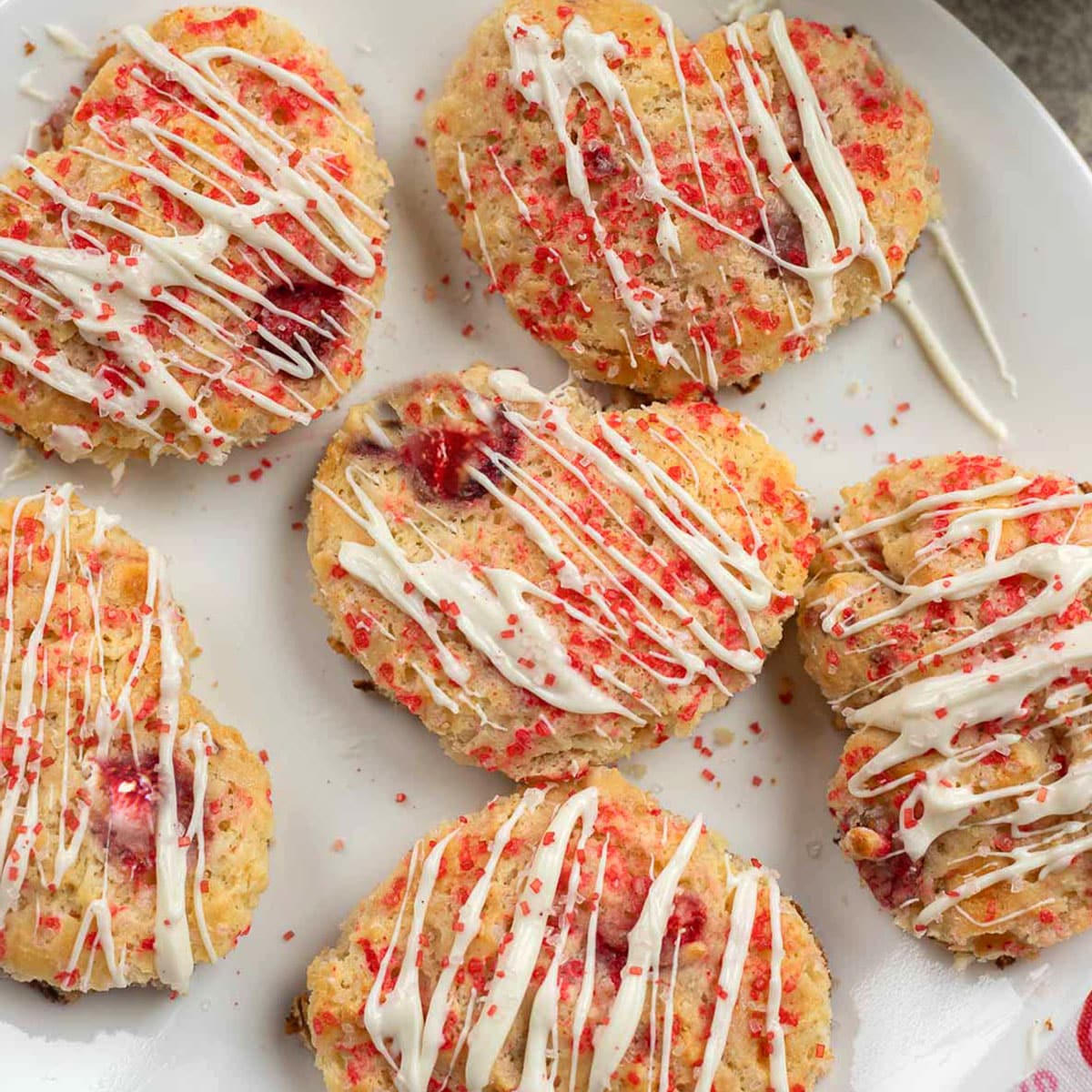 strawberry scones drizzled with melted white chocolate
