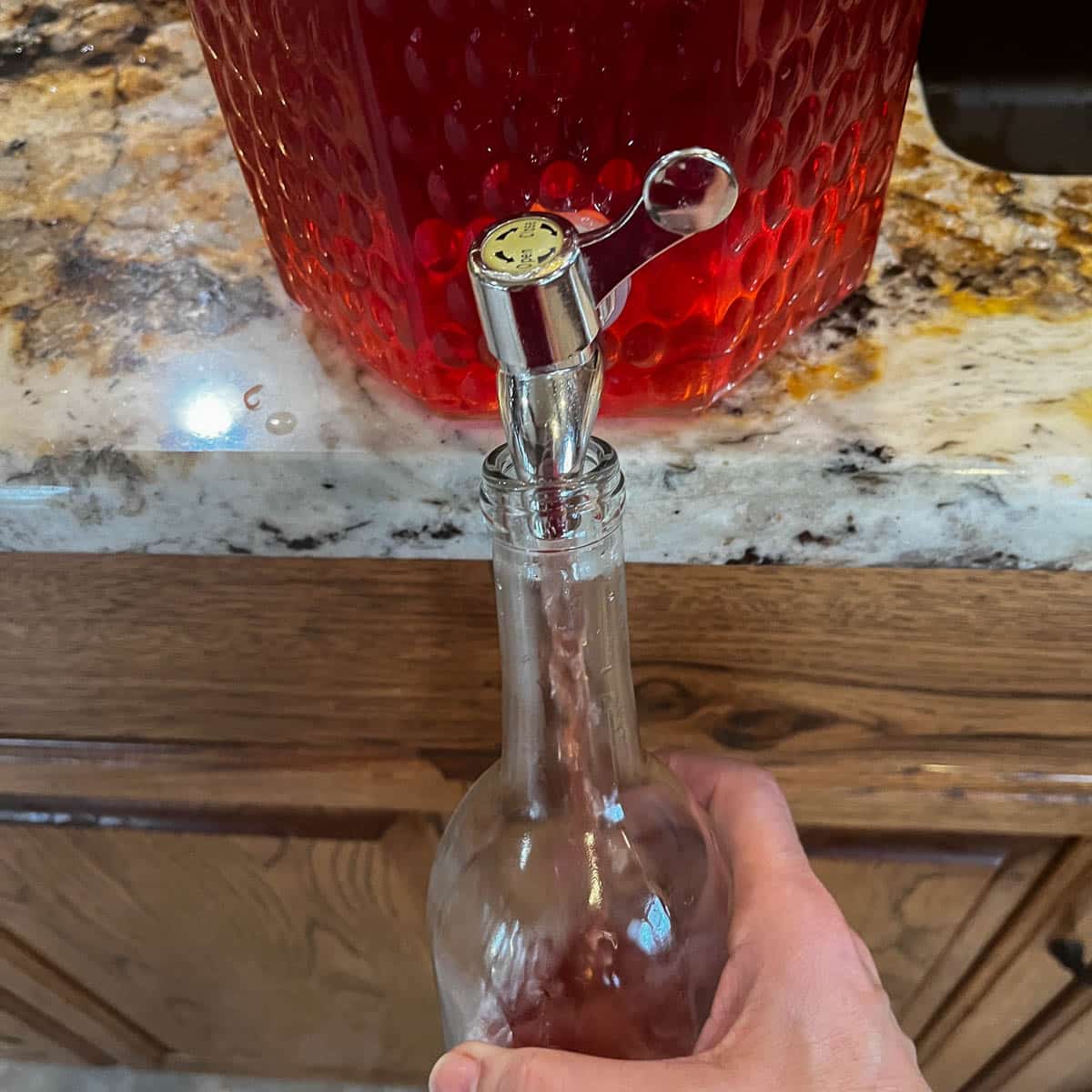 pouring wine into bottles