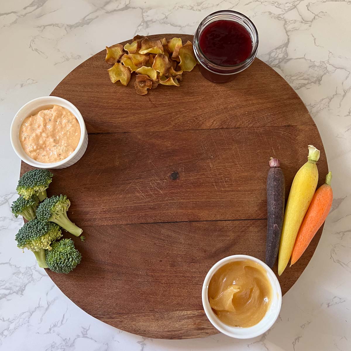 veggies and spreads on board