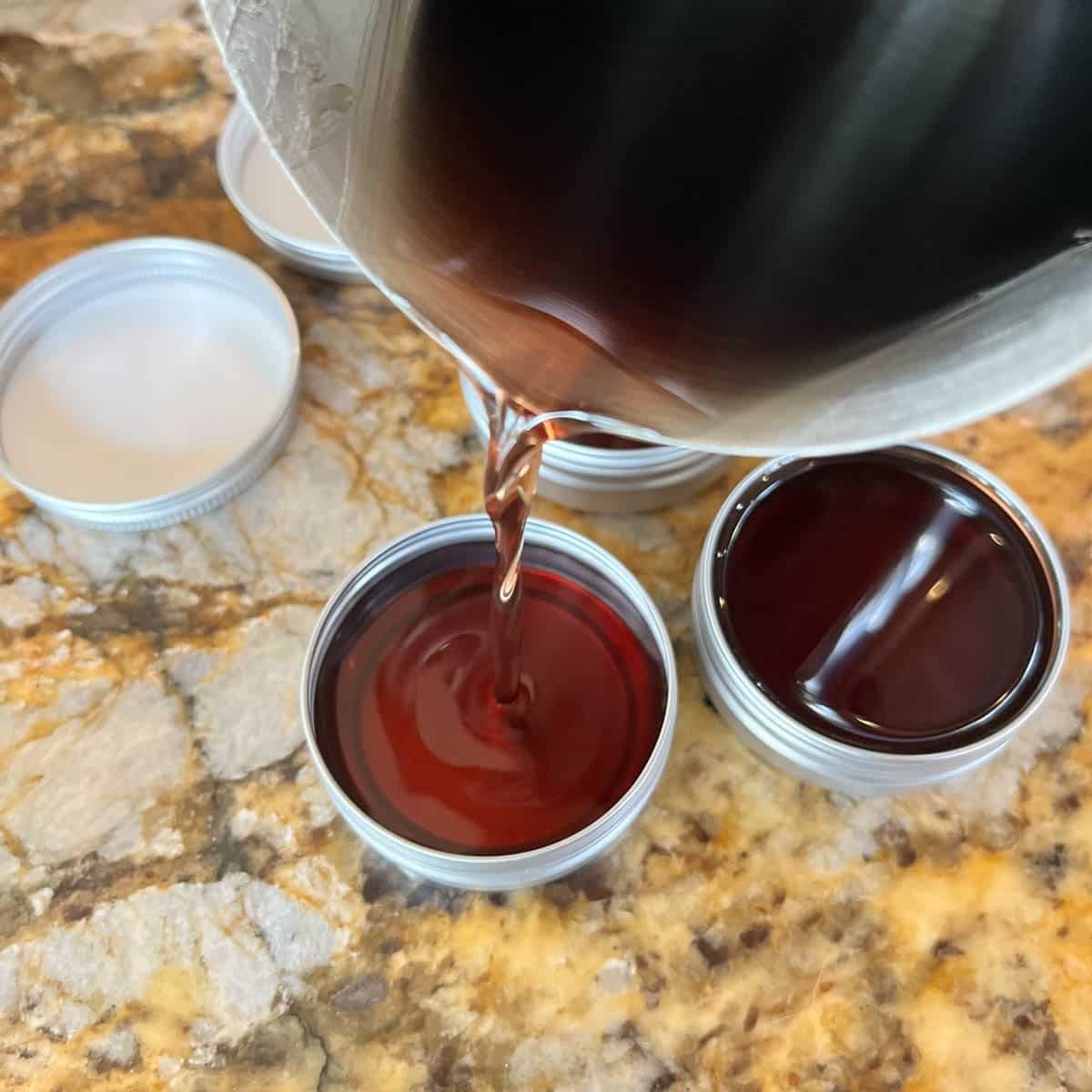 pouring balm of gilead into containers.