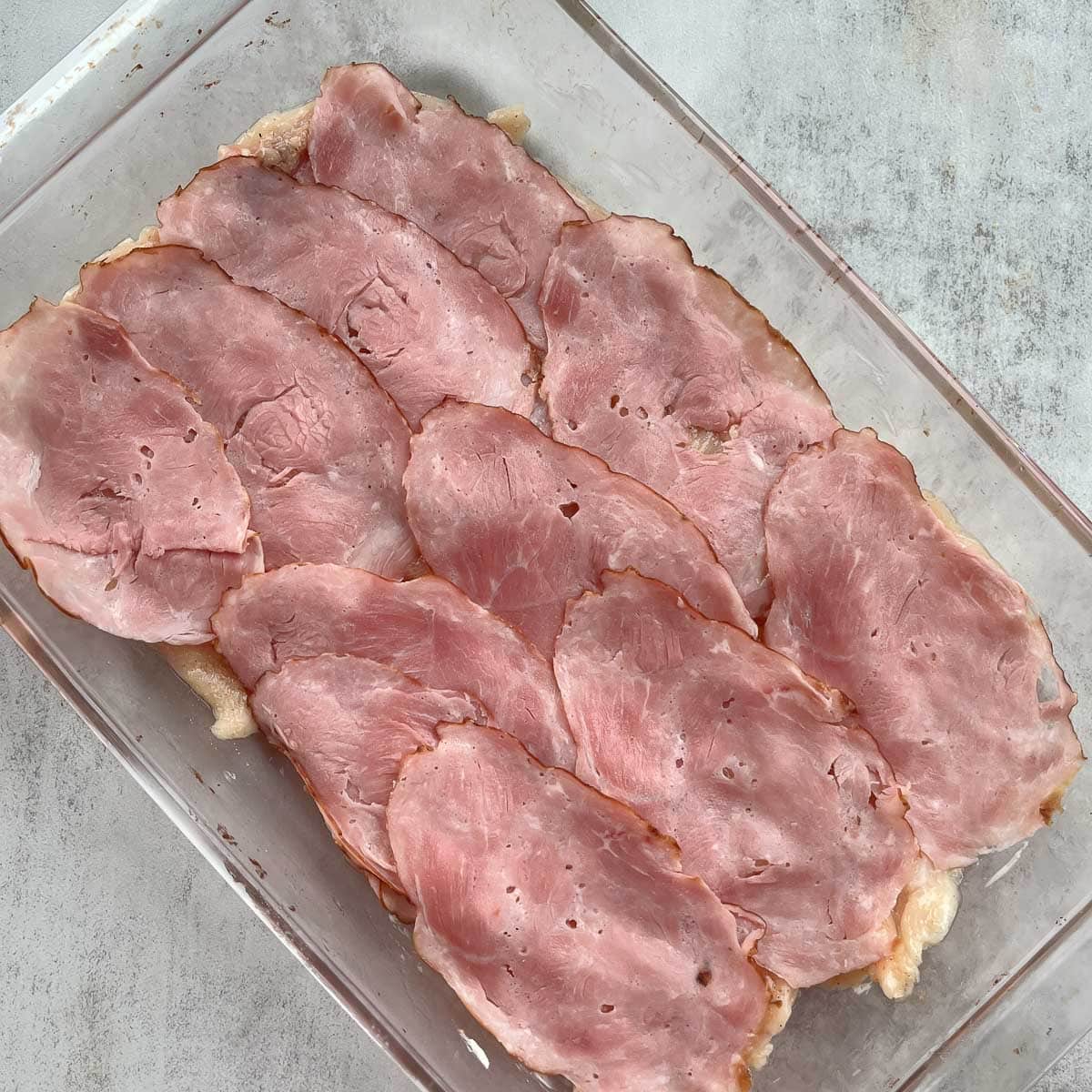 a baking dish with ham.