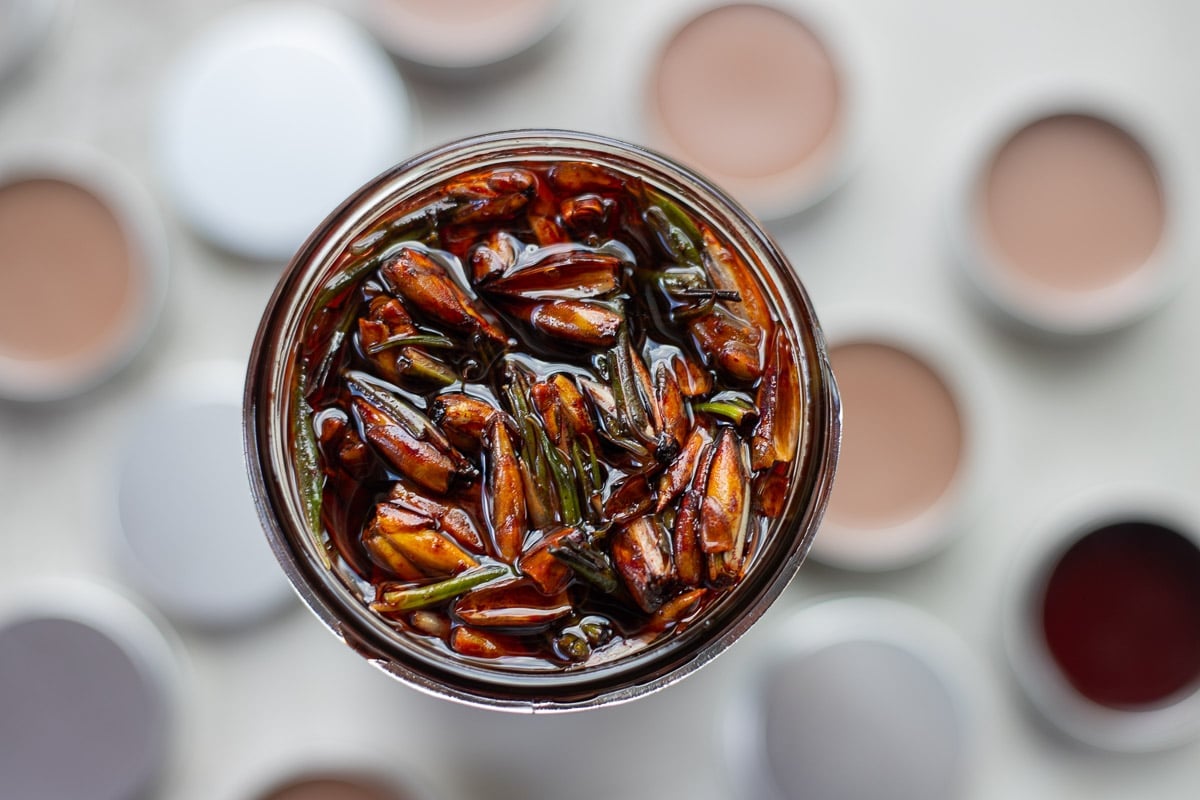 balm of gilead in a mason jar with more in the background.