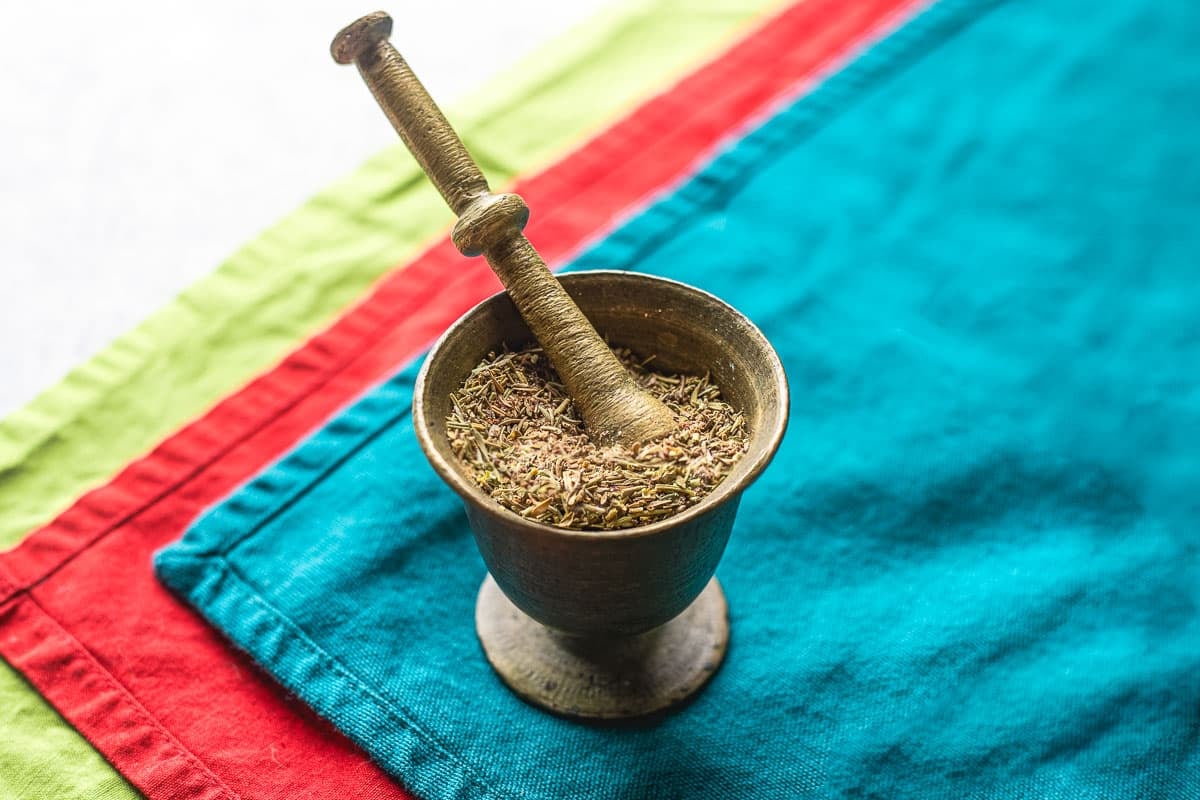 lamb seasoning in mortar on colorful placemats