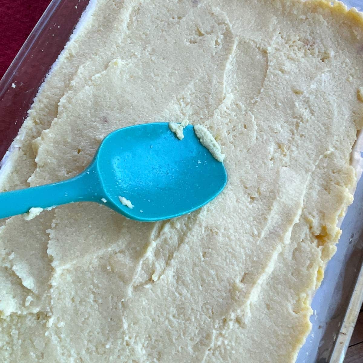 spreading custard over phyllo dough.