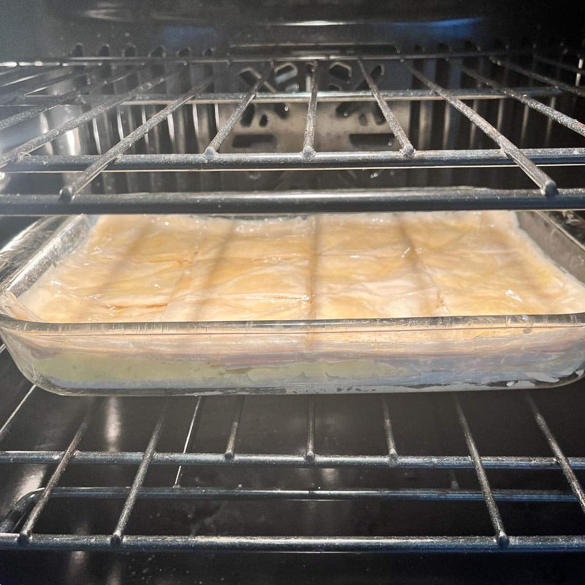 Greek Galaktoboureko baking in the oven.