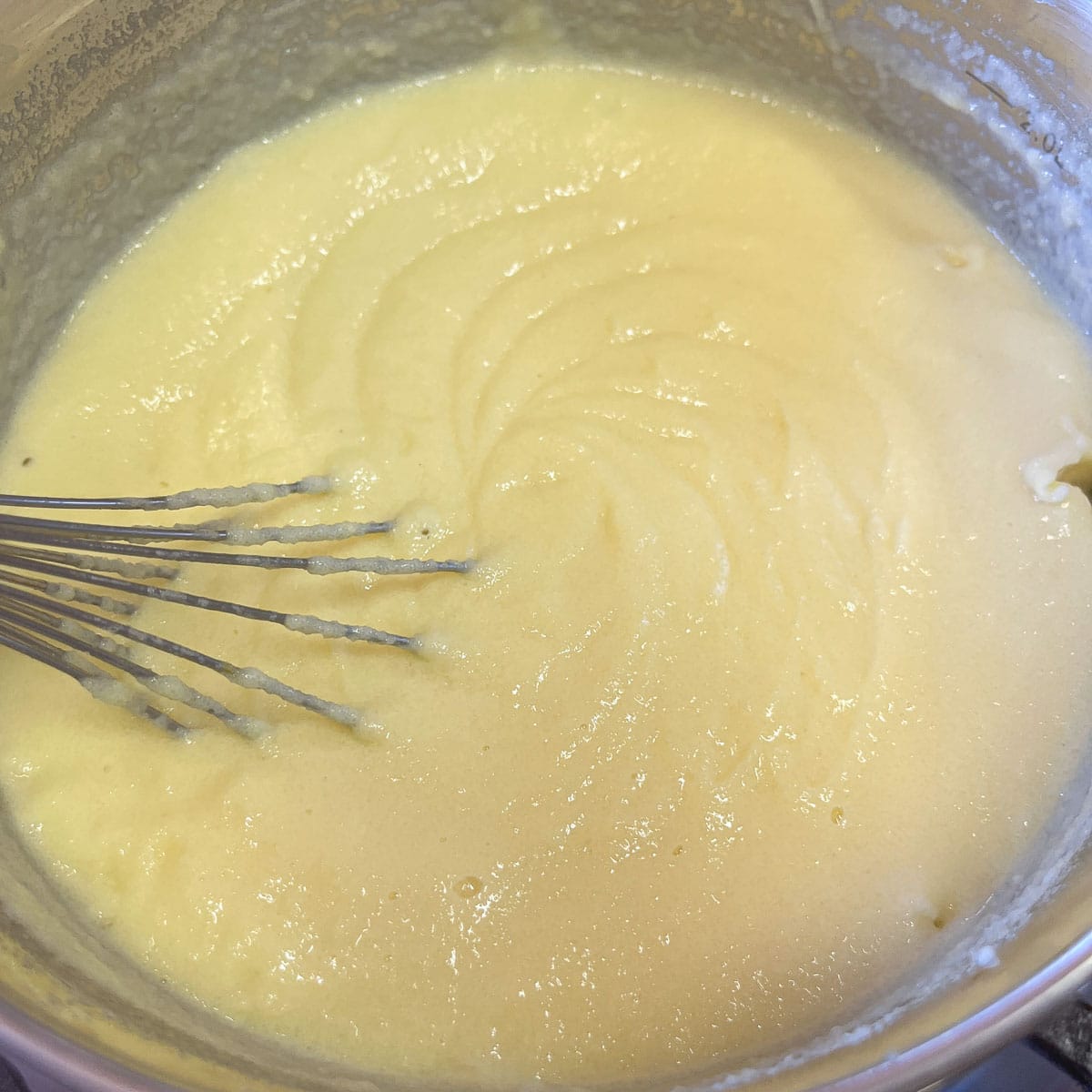 custard cooking in a pot.