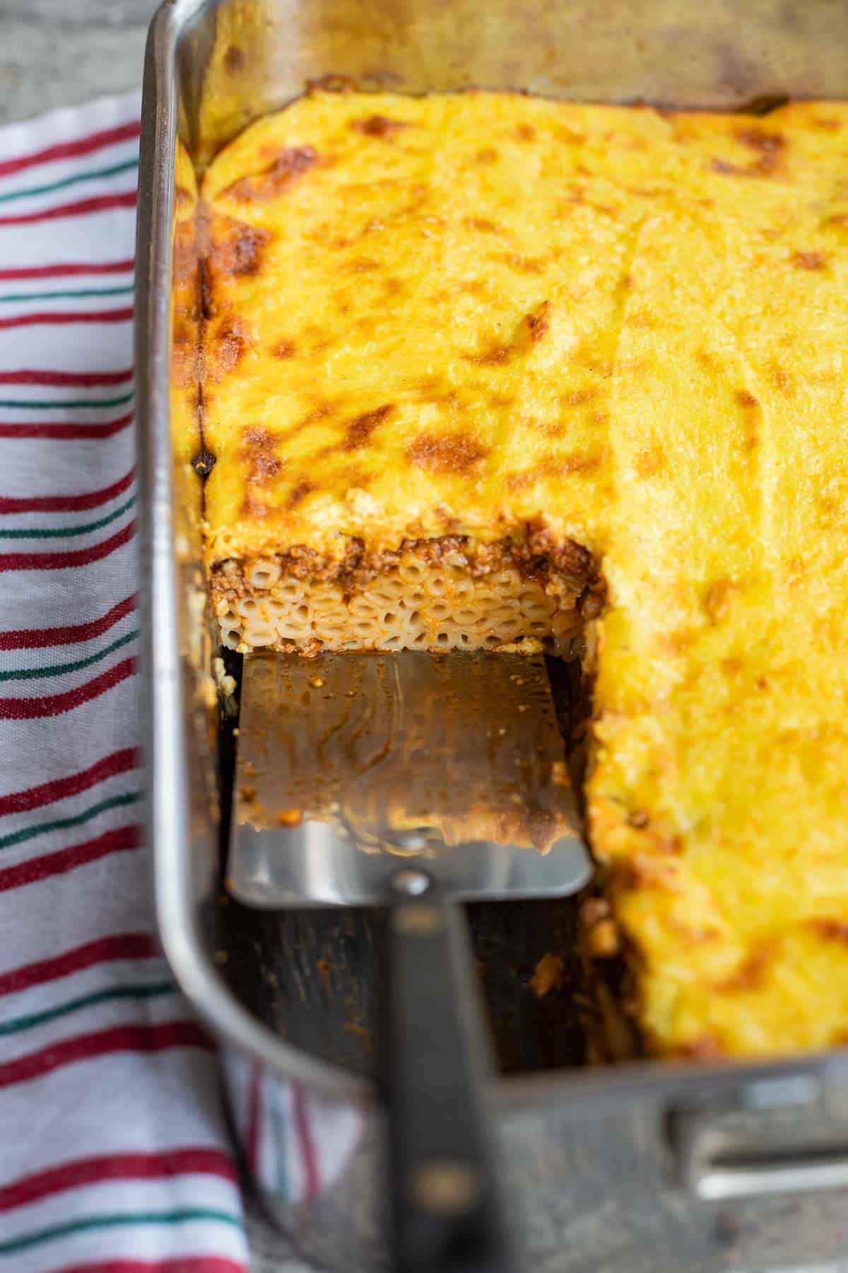 a slice of pastitsio being served
