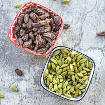 black cardamom and green cardamom in bowls