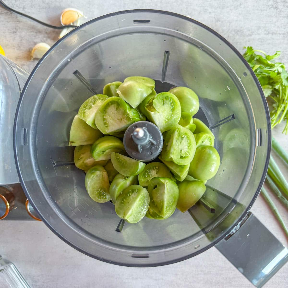 green tomatoes in a food processor.