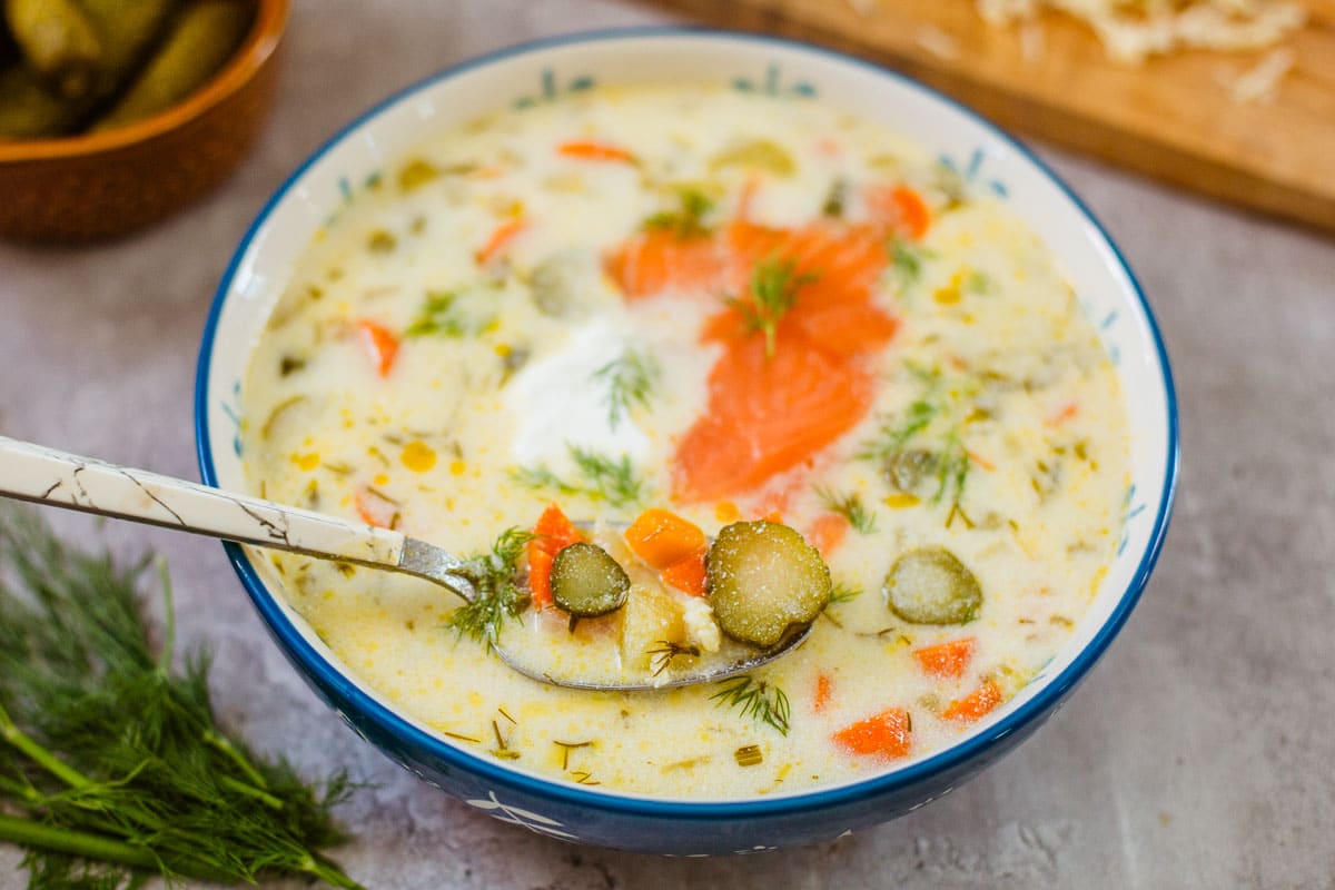 zupa ogorkowa (Polish pickle soup) with salmon & sour cream and spoon