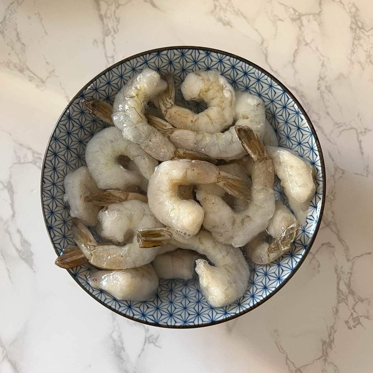 shrimp defrosting in bowl