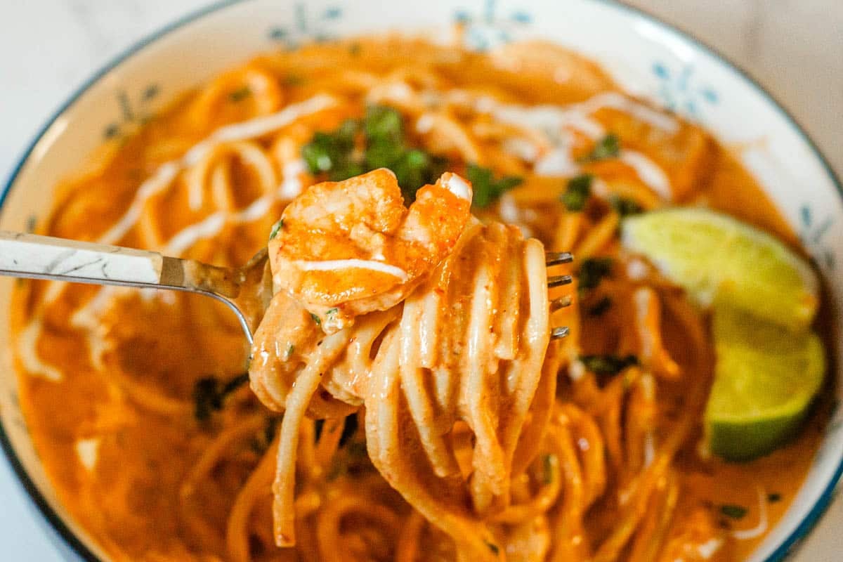 closeup of chipotle creamy shrimp pasta on fork with shrimp on top