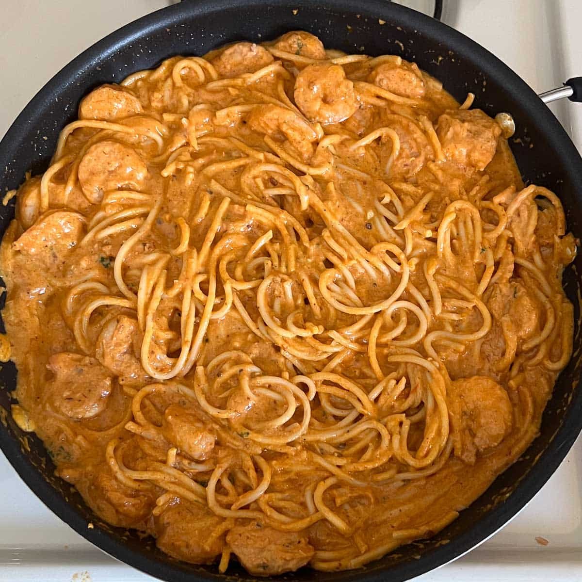 creamy chipotle shrimp pasta in pan