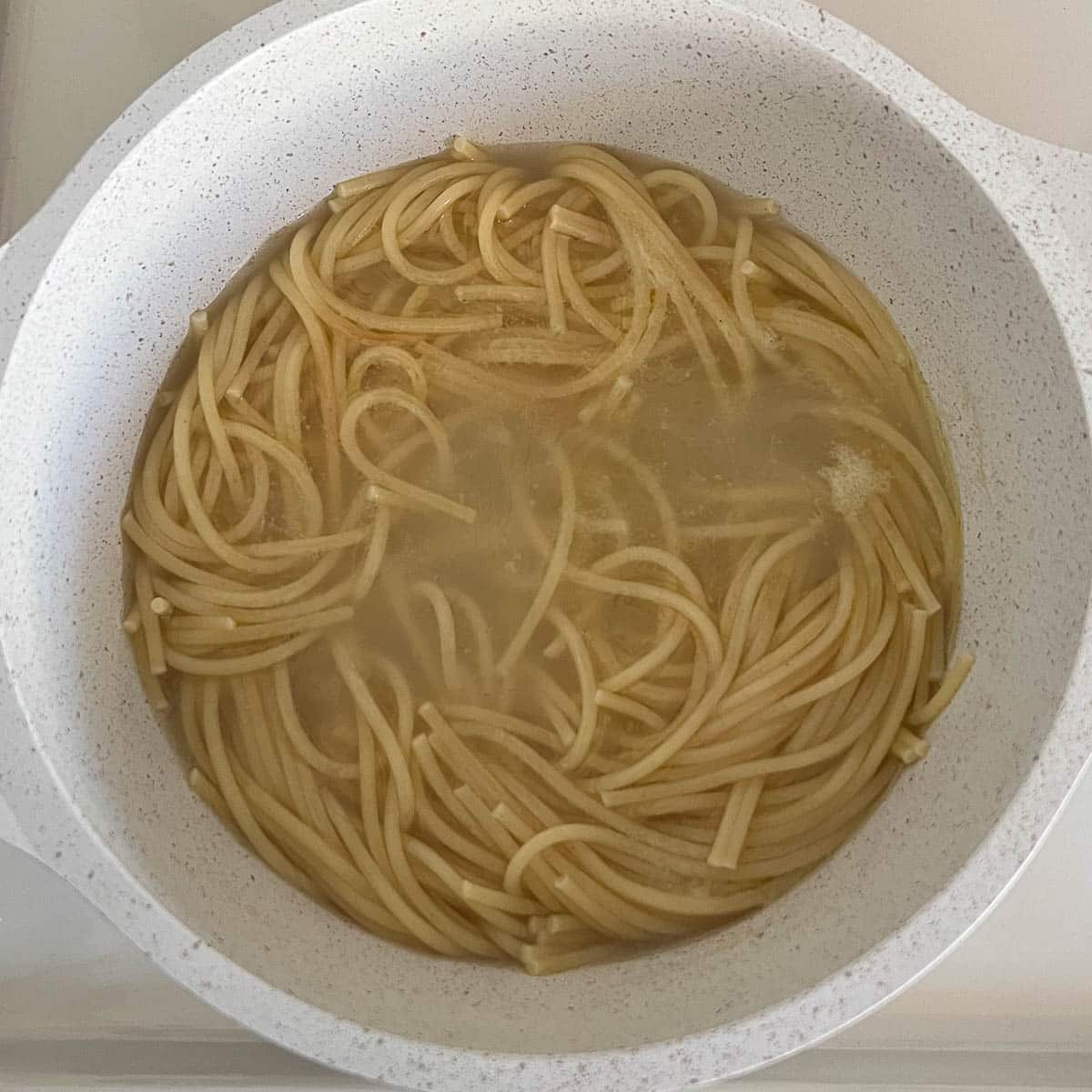 cooked spaghetti noodles in pot