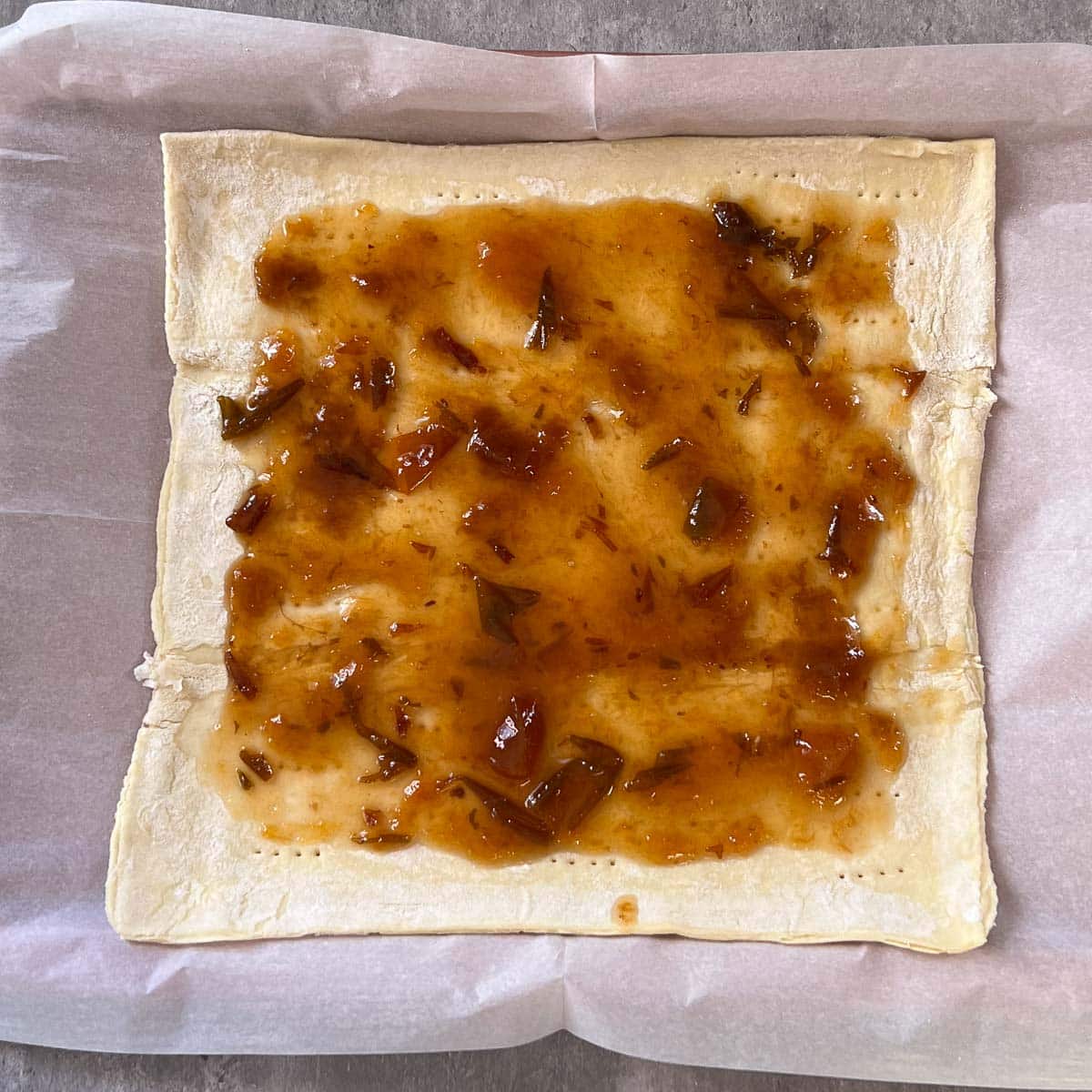 puff pastry with plum jam spread on top